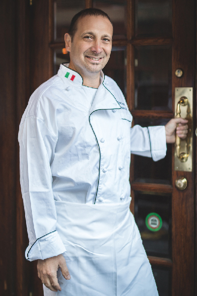 Image of Dino in chef uniform